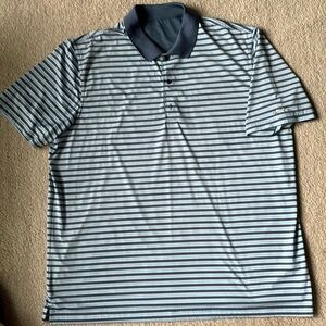 Blue striped Greg Norman golf shirt